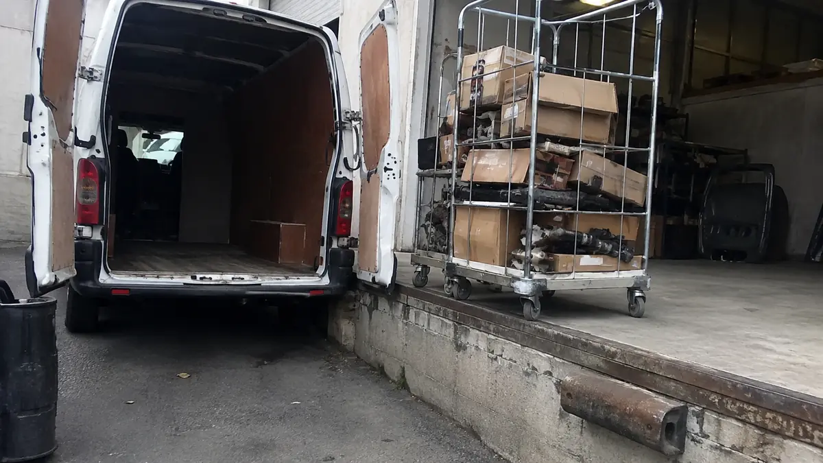 Parts delivery van outside an independent repair shop in Farmers Branch, TX