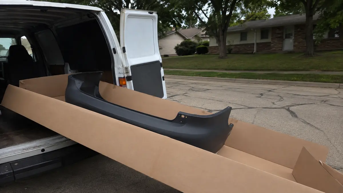 Parts delivery van outside an independent repair shop in Garland, TX